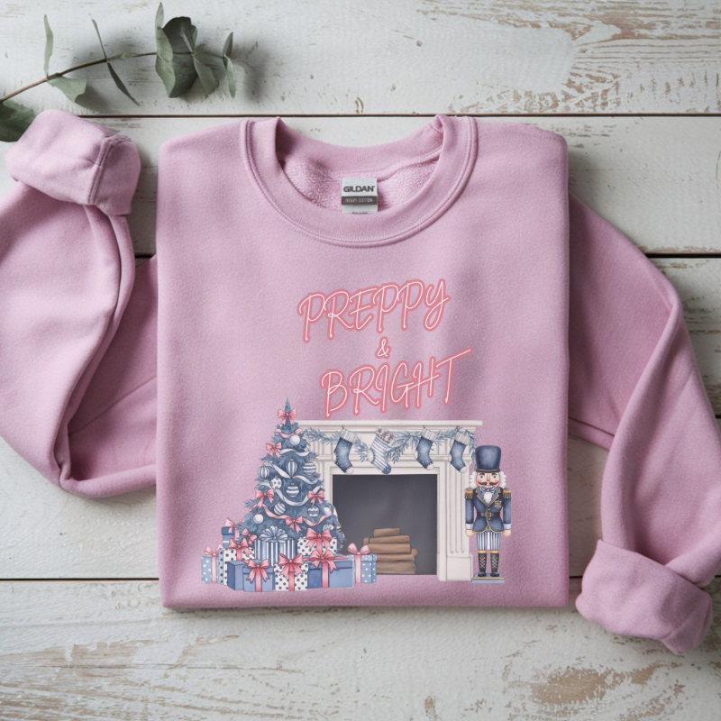 Preppy & Bright Christmas Sweatshirt | Blue Pink Holiday Crewneck with Nutcracker, Tree & Fireplace | Cozy Unisex Festive Winter Sweater