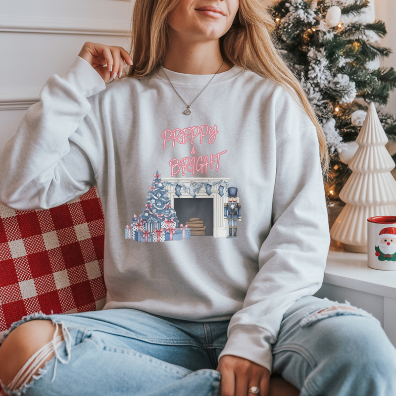Preppy & Bright Christmas Sweatshirt | Blue Pink Holiday Crewneck with Nutcracker, Tree & Fireplace | Cozy Unisex Festive Winter Sweater
