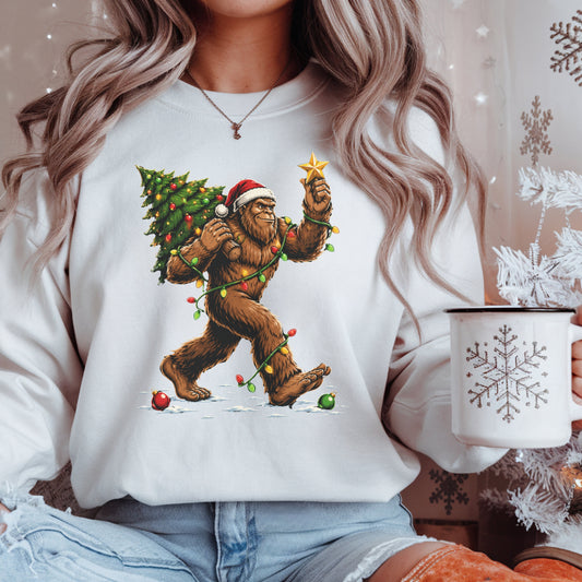 Sweatshirt — Holiday Sasquatch Carrying Christmas Tree Graphic Crewneck