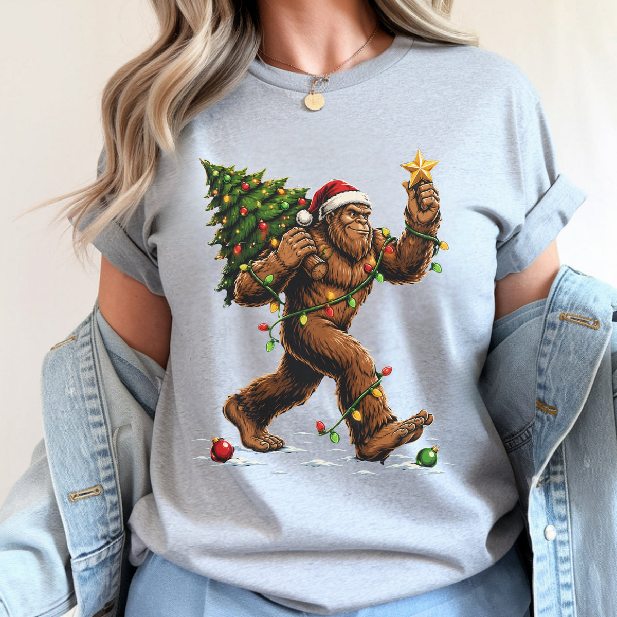 Sasquatch Carrying Christmas Tree T-Shirt — Holiday Bigfoot Santa Tee